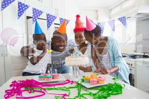 Happy family celebrating a birthday together