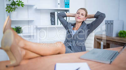 Pretty blonde businesswoman relaxing herself