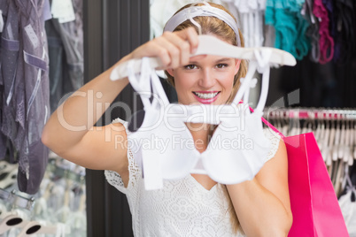 A pretty woman buying bras