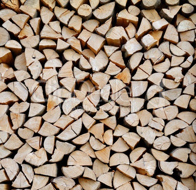 Texture of a stack of chopped firewood