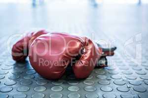Close up view of boxing gloves on industrial floor