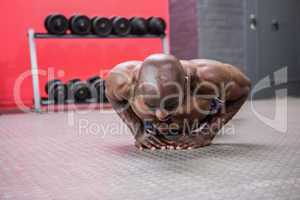 Young bodybuilder doing excercises