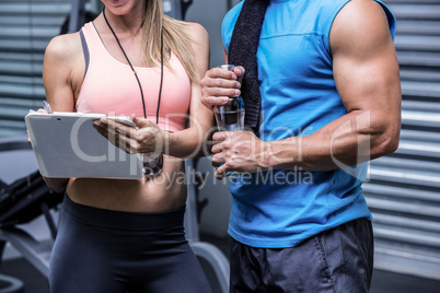 Young woman smiling with a young man