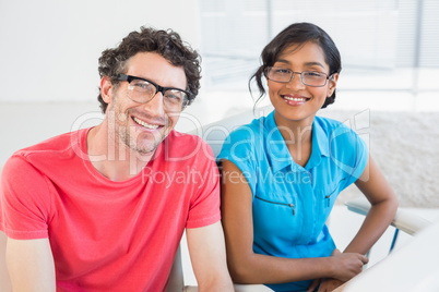 Casual business team working together at desk