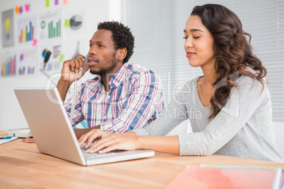 Young business people on the laptop