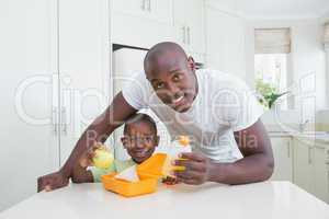 Portrait of a father working with his son