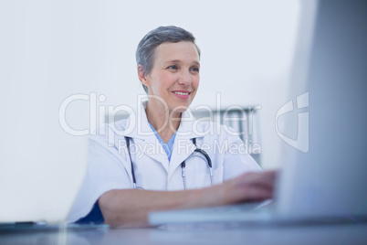 Female doctor using her laptop computer