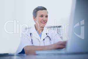 Female doctor using her laptop computer