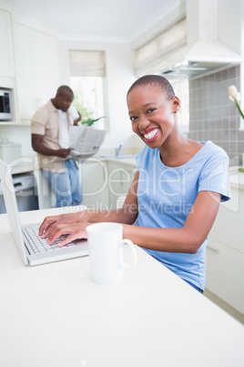 Portrait of a happy smiling pretty woman using her laptop