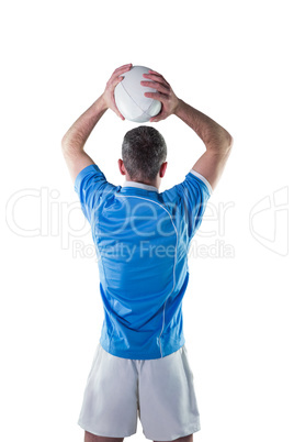 Rugby player about to throw a rugby ball