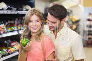 Portrait of smiling bright couple buying food products