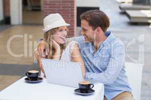 Smiling cute couple discussing together