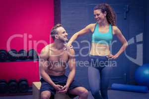 Standing and sitting muscular couple