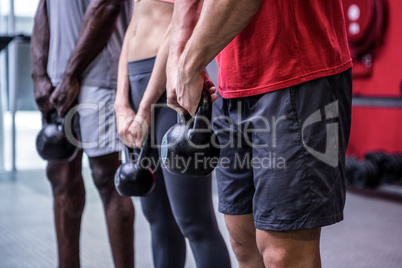 Three young Bodybuilders doing weightlifting