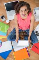 Young creative businesswoman holding a tablet