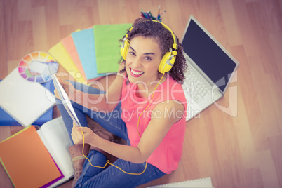 Young creative businesswoman holding a tablet