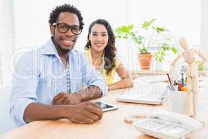 Young smiling business people looking at the camera