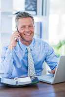 Serious businessman having phone call