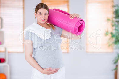 Pregnant woman keeping in shape Pregnant woman keeping in shape