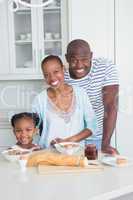 Portrait of a happy family sitting and taking breakfast