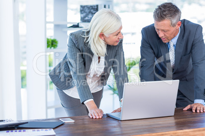 Business people working on laptop computer