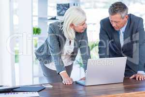 Business people working on laptop computer