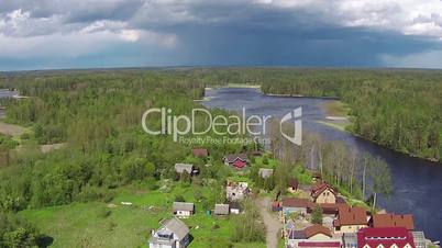 Flying Above Village near Lake, sunny day