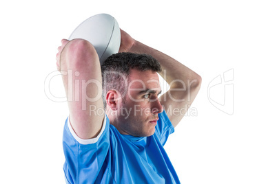 Rugby player about to throw a rugby ball