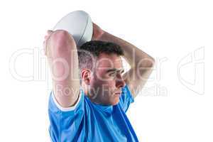 Rugby player about to throw a rugby ball