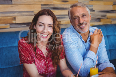 Cute couple sitting in cafe