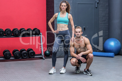 Standing and kneeling muscular couple