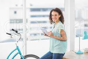 Smiling businesswoman holding a digital tablet