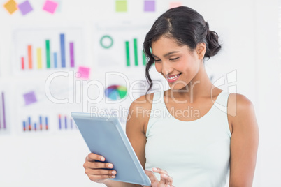 Casual brunette showing tablet computer