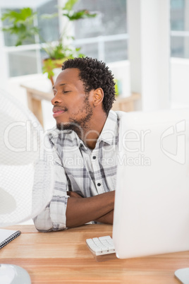 Young businessman sitting at his desk