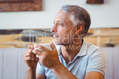 Man sitting in cafe having coffee