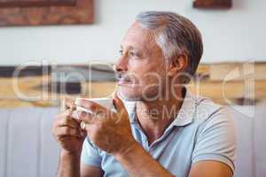 Man sitting in cafe having coffee