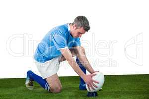 Rugby player ready to make a drop kick