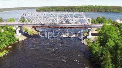 Flying Above Iron Bridge over River, aerial view