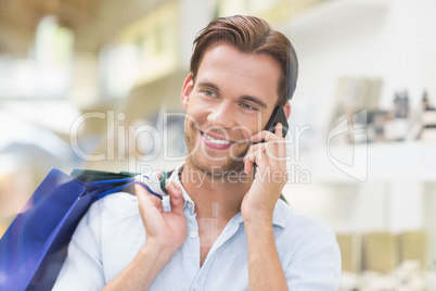 A happy smiling man calling