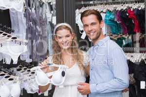 Cute couple buying underwear gears