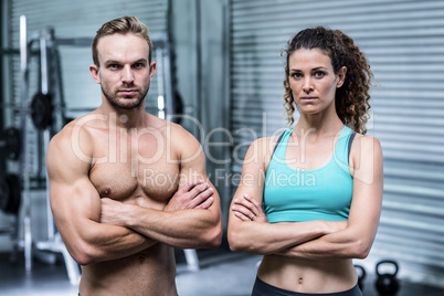 Muscular couple looking at the camera