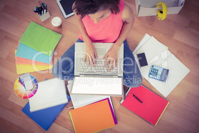 Young creative businesswoman working on laptop