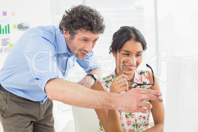 smiling casual young couple at work