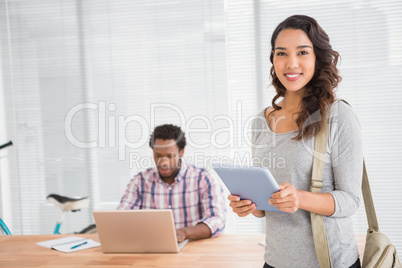 Young business people smiling at the camera