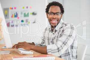 Young businessman smiling at the camera