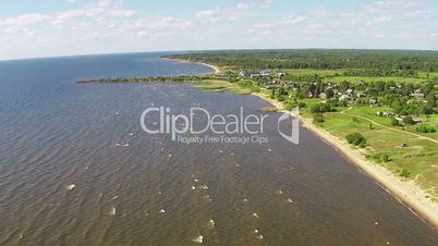 Flying Above Shore Lake, sunny day