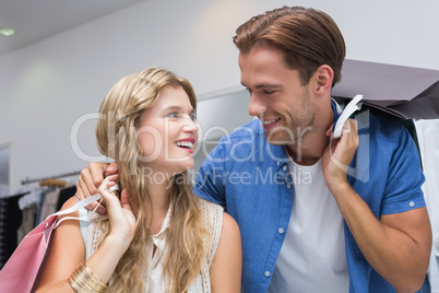 A happy couple with shopping bags