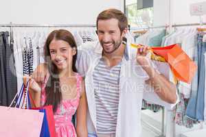 Portrait of smiling couple with shopping bags