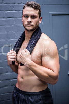 Portrait of muscular man looking at camera