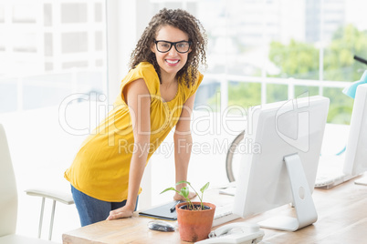 Creative young businesswoman looking at the camera